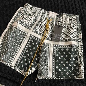 Rhude Geometric green and white bandana shorts.